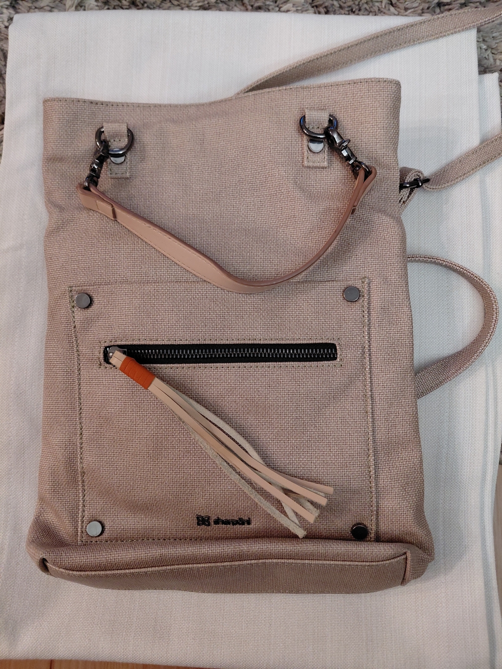 Sherpani Beige Canvas Crossbody Tote with Tassel Accent